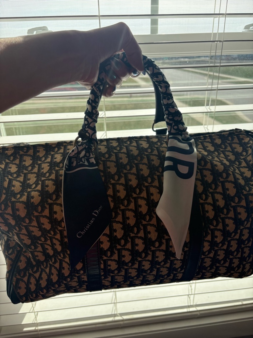 Dior blue Oblique Canvas Barrel Bag.